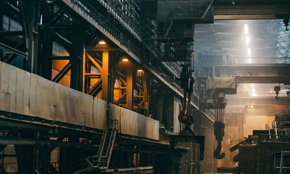 Steel plant factory interior with overhead crane hooks